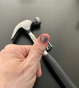 Pain caused by smashing thumb with hammer